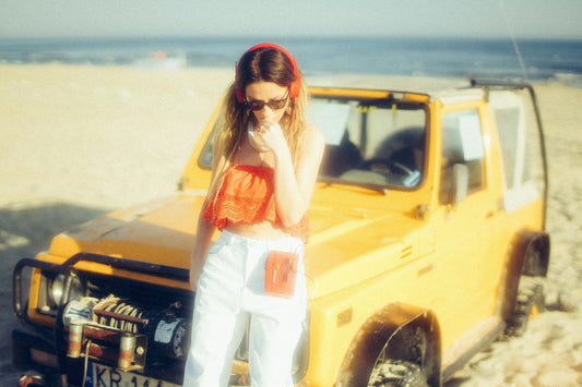 walkman music headphones car and beach in background