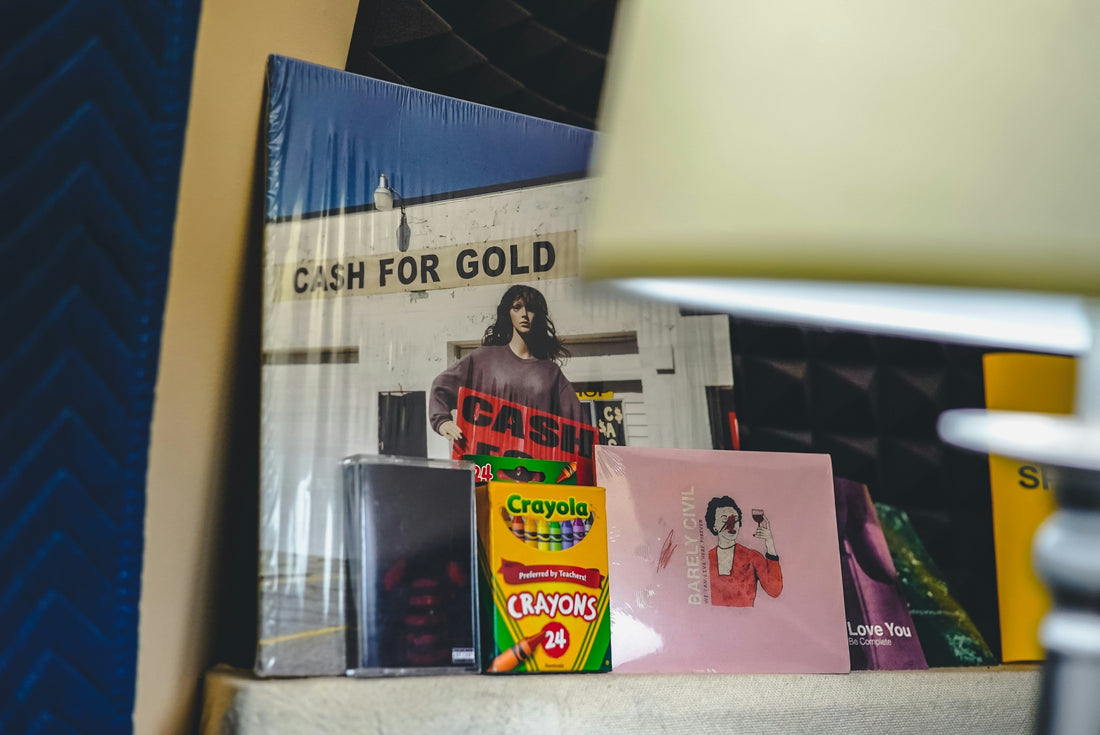 vinyl, cassettes and CD's on a shelf