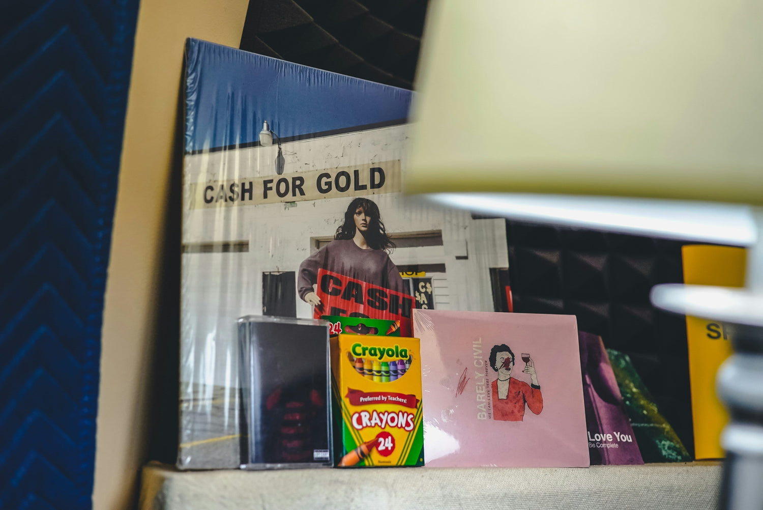 vinyl, cassettes and CD's on a shelf