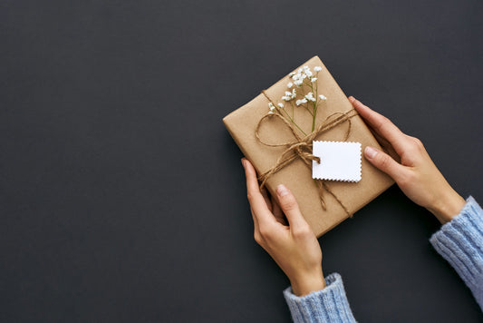 Beautifully wrapped gift in hand 