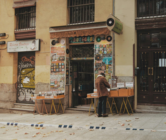 Man browsing vinyl outside record store 