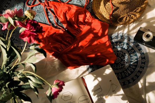 Summer vibe swimsuit sun hat camera flowers 