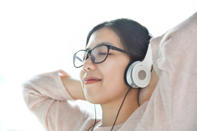 girl listening on headphones